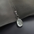 Sekrety strumyka - srebrny wisior z kryształem andara