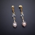 Kornelia Sus, Biżuteria, Kolczyki, Zimowy świt - srebrne kolczyki z perłami, pozłacanym srebrem i motywem róży