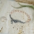 Alabama Studio, Biżuteria, Bransolety, Perłowy przypływ - asymetryczna srebrna bransoleta z brzoskwiniowymi perłami