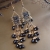 Nina Rossi Jewelry, Biżuteria, Kolczyki, Dazzling black chandeliers