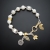 Kornelia Sus, Biżuteria, Bransolety, Muślinowe mgły - srebrna bransoletka z perłami i motywem kwiatowym