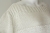 Biały pulower wykonany z bawełny i lnu, z błyszczącymi cekinami, gotowy do wysyłki / Knitwear Factory / Moda / Swetry i poncza