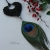 Feather glam - wyjątkowy wisior z naturalnej skóry z pawim piórem / Soft Things / Biżuteria / Wisiory