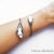 Bransoletka srebrna - Lilie z perłą  / VENUS GALERIA / Biżuteria / Bransolety