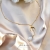 ON THE MOON - minimalistyczny złocony naszyjnik z kamieniem księżycowym, perłami i księżycem / PASIÓN / Biżuteria / Naszyjniki