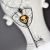 OLLACHEA - srebrny naszyjnik z wisiorem w kształtcie klucza z Cytrynem i Rodolitami / PASIÓN / Biżuteria / Naszyjniki