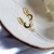 NEW MOON - krótkie złocone srebrne kolczyki z księżycem i perłami / PASIÓN / Biżuteria / Kolczyki